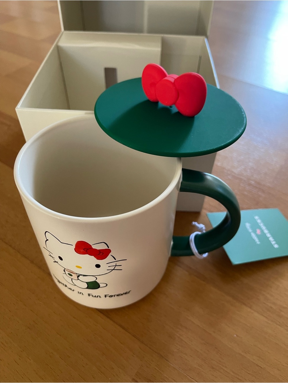 Starbucks Hello Kitty White Ceramic Mug with Green Handle and Red Bow Lid